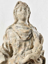 Detailed stone sculpture of origin Mary