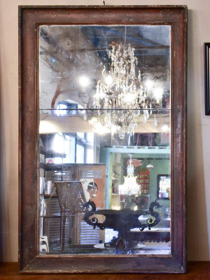 Large antique French two-piece mirror with dark frame