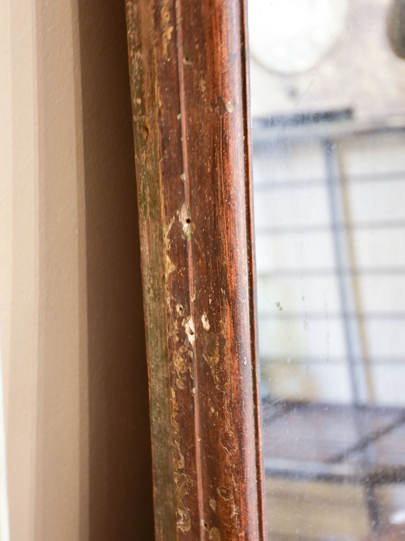 Large antique French two-piece mirror with dark frame