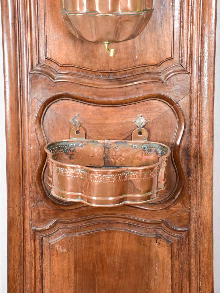 Louis XIV walnut boiserie panel with copper fountain and basin