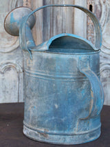 Antique French watering can with blue patina