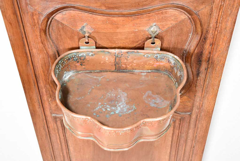 Louis XIV walnut boiserie panel with copper fountain and basin
