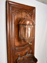 Walnut boiserie panel with copper fountain