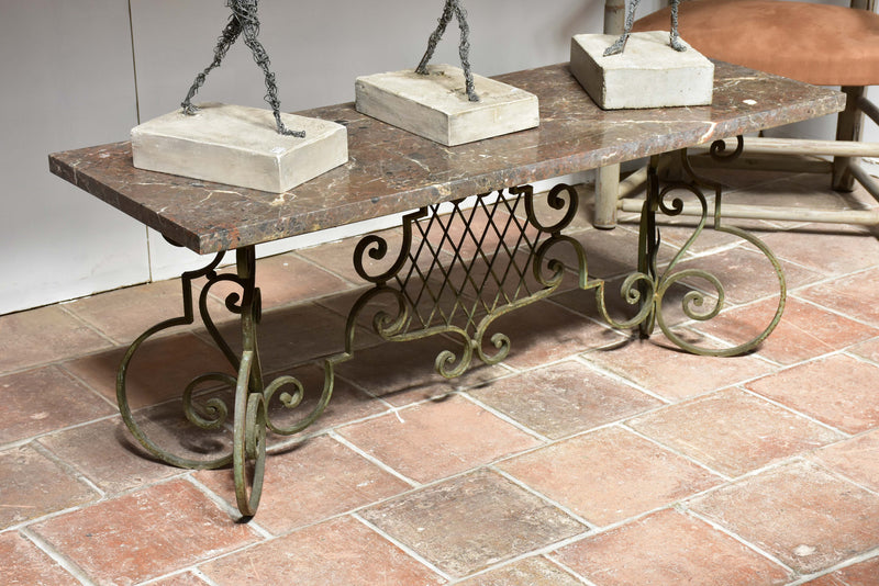 Marble top coffee table with decorative wrought iron base