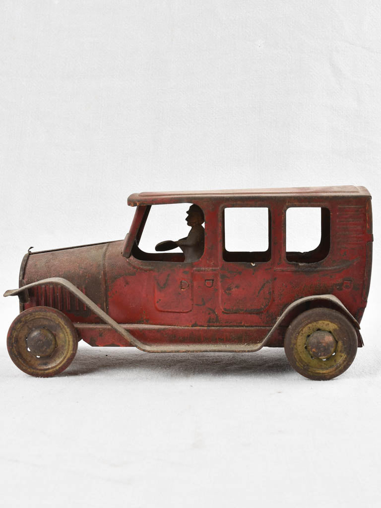 Time-worn red American push toy