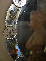 Round art pauvre venetian mirror