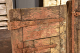Pair of antique French shutters with original hardware and red patina