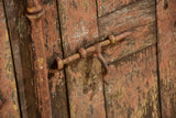 Pair of antique French shutters with original hardware and red patina