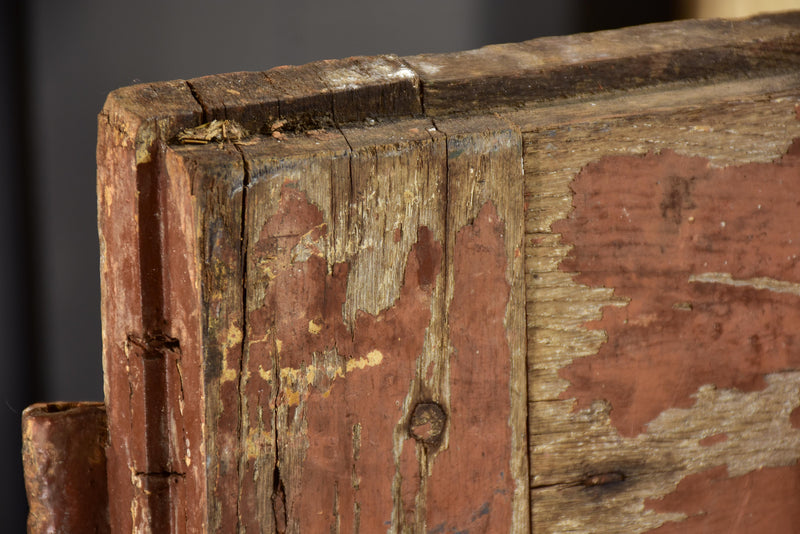 Pair of antique French shutters with original hardware and red patina