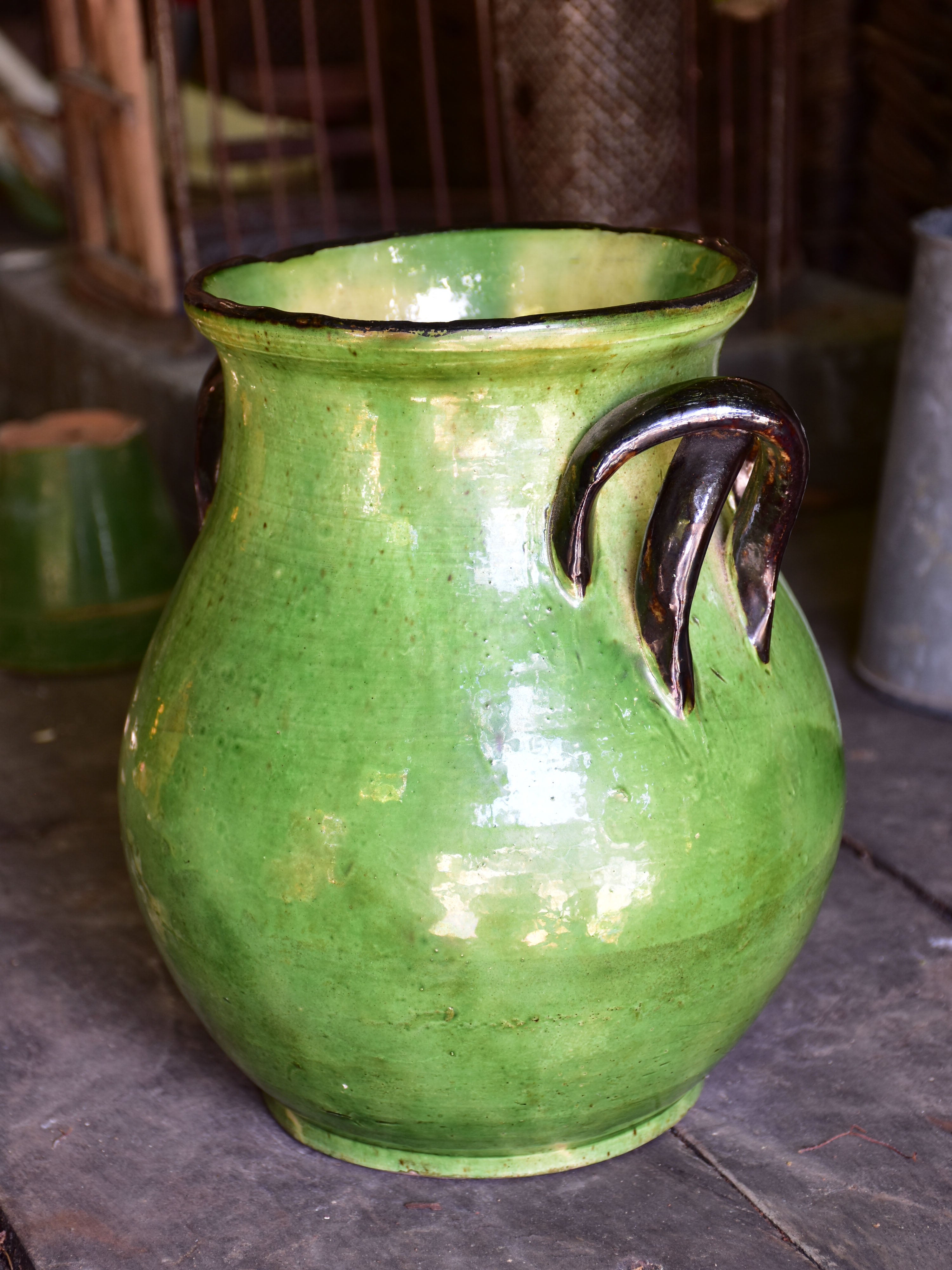 Rare green glazed vase with pretty black handles from the Ardeche