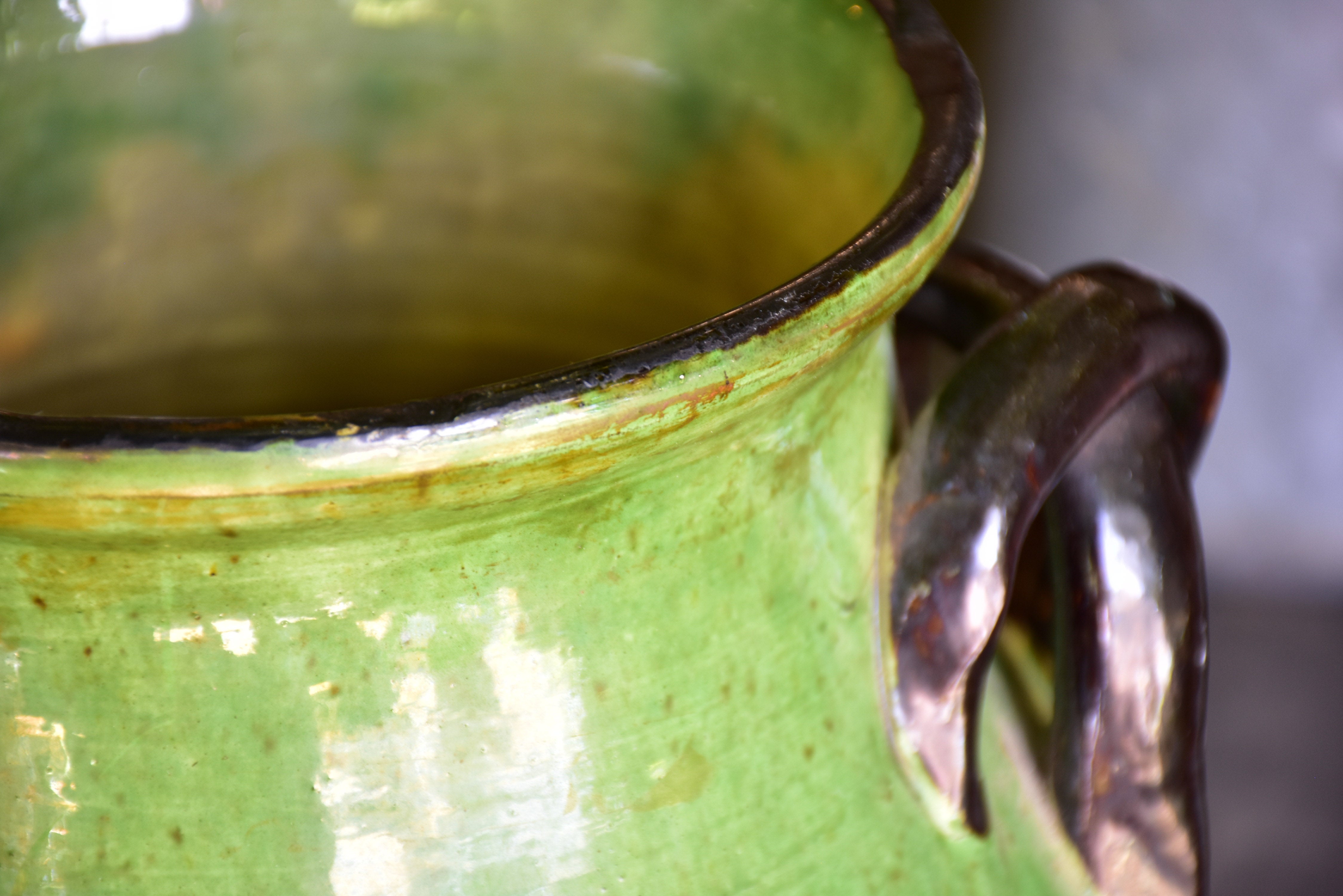 Rare green glazed vase with pretty black handles from the Ardeche