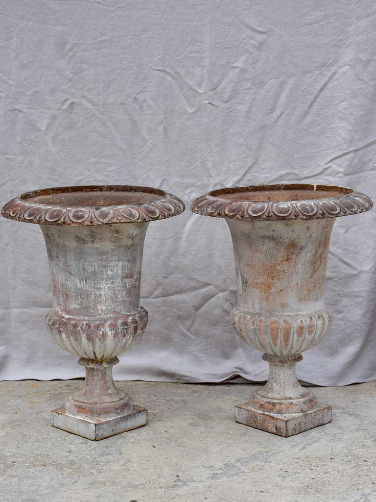 Pair of large 19th Century cast iron Medici urns 26½"