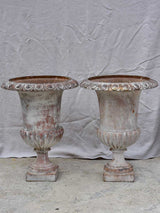 Pair of large 19th Century cast iron Medici urns 26½"