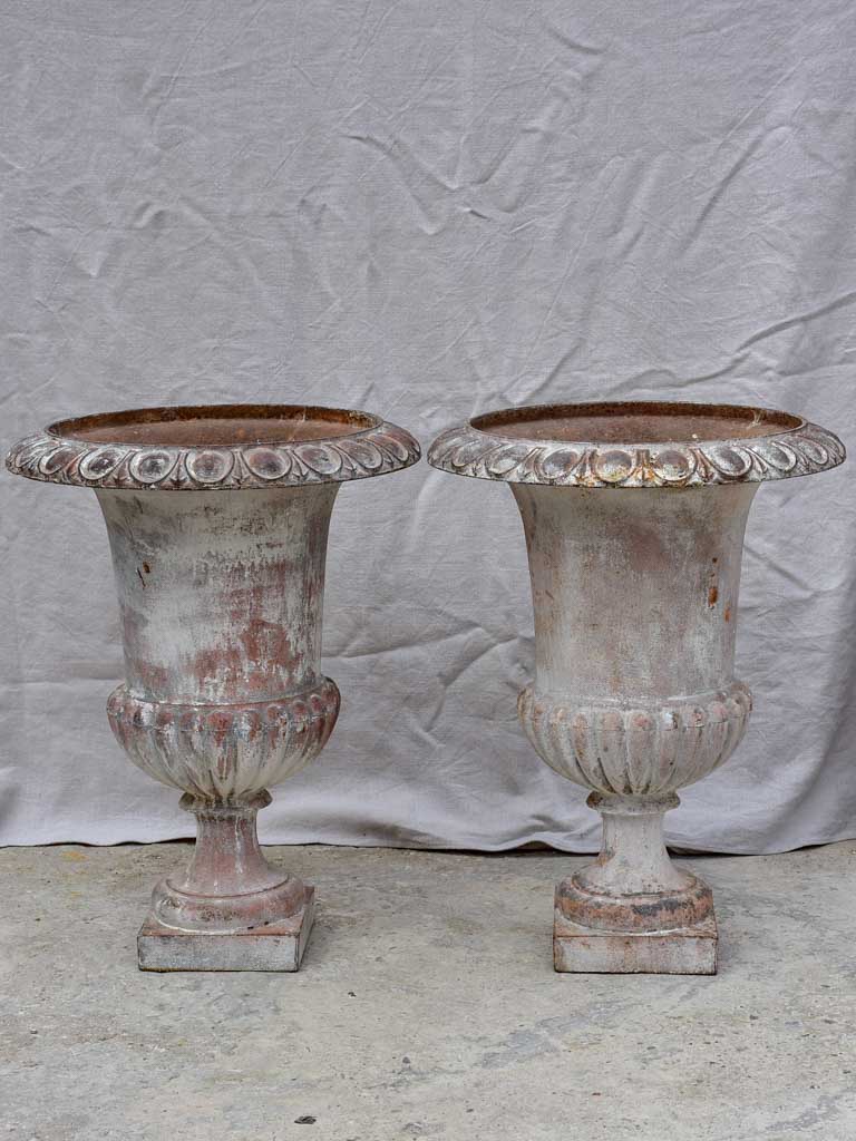 Pair of large 19th Century cast iron Medici urns 26½"