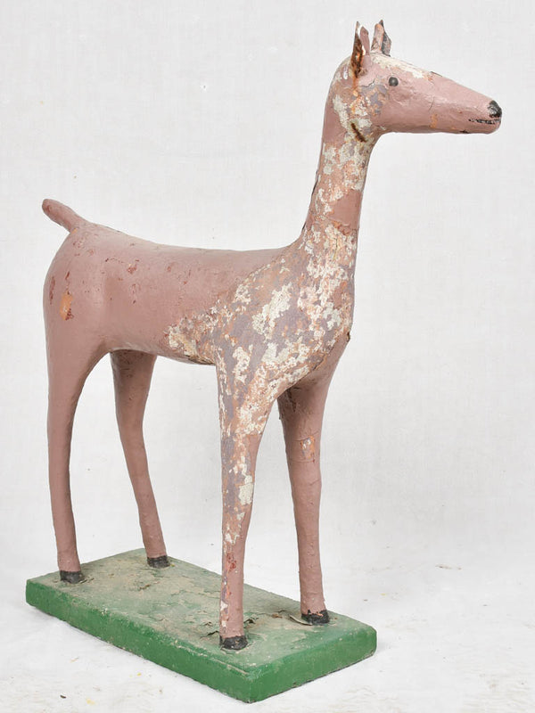 Small mid century garden statue of a deer with a veiled pink patina 28¾"