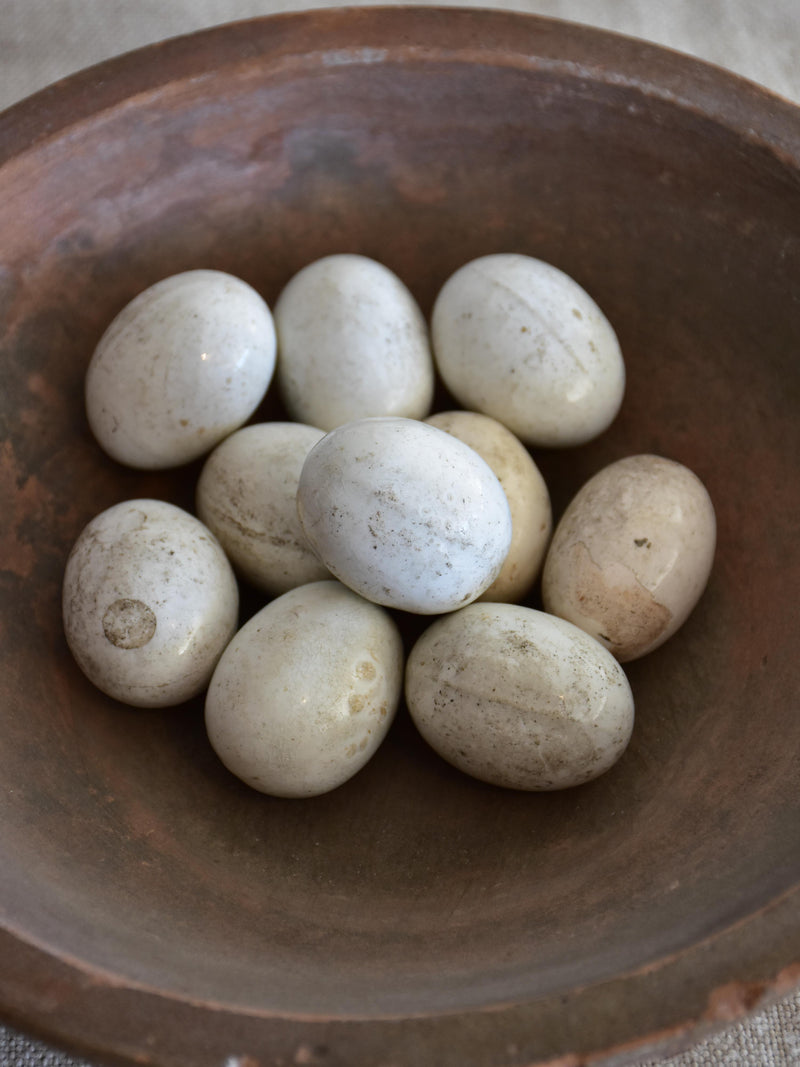 Nine antique French porcelain training eggs