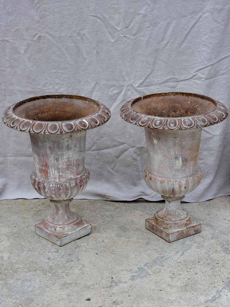 Pair of large 19th Century cast iron Medici urns 26½"
