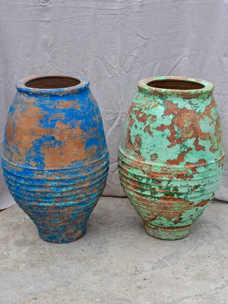 Two very large antique Spanish olive oil jars - blue and green