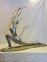 Large vintage resin sculpture of a woman practicing yoga