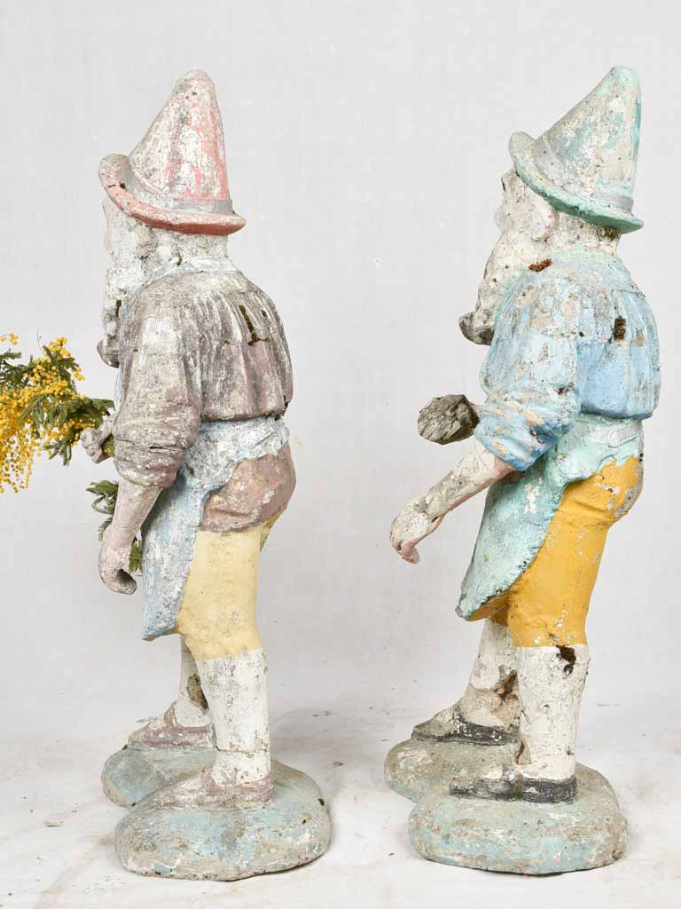 Antique garden gnomes with patina