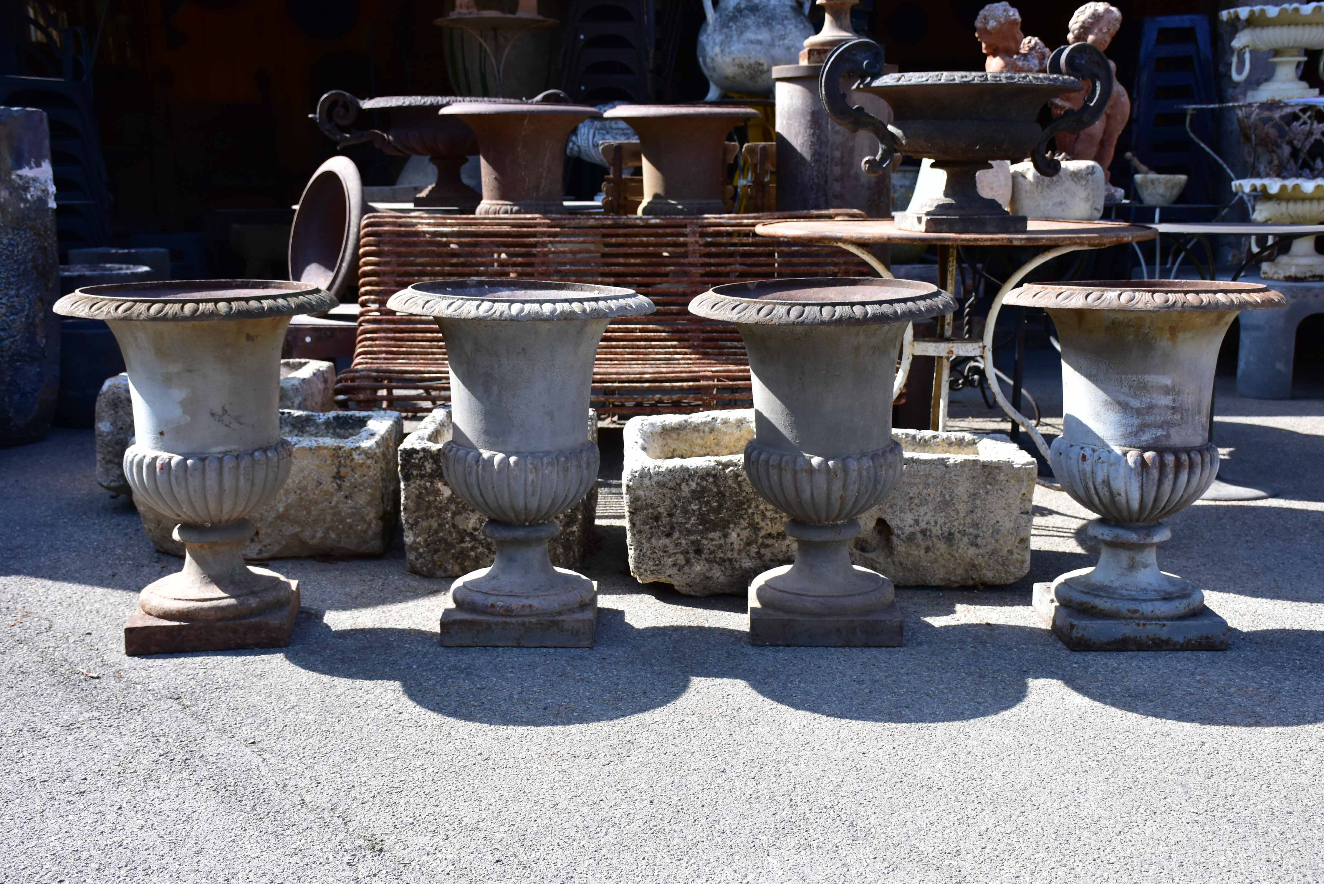 Collection of four cast iron medici urns from the 19th century