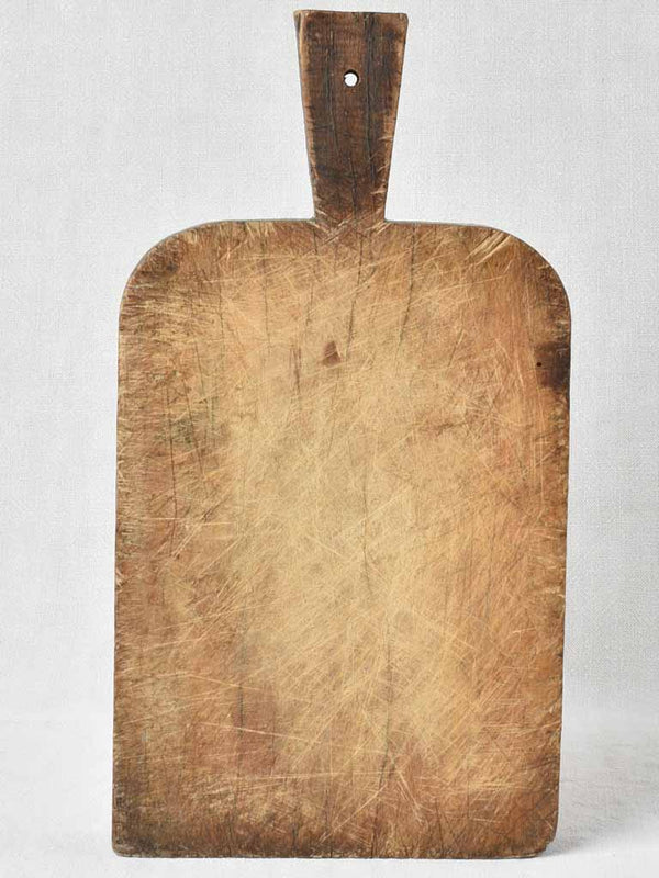 Antique French cutting board with rounded shoulders 17" x 9"
