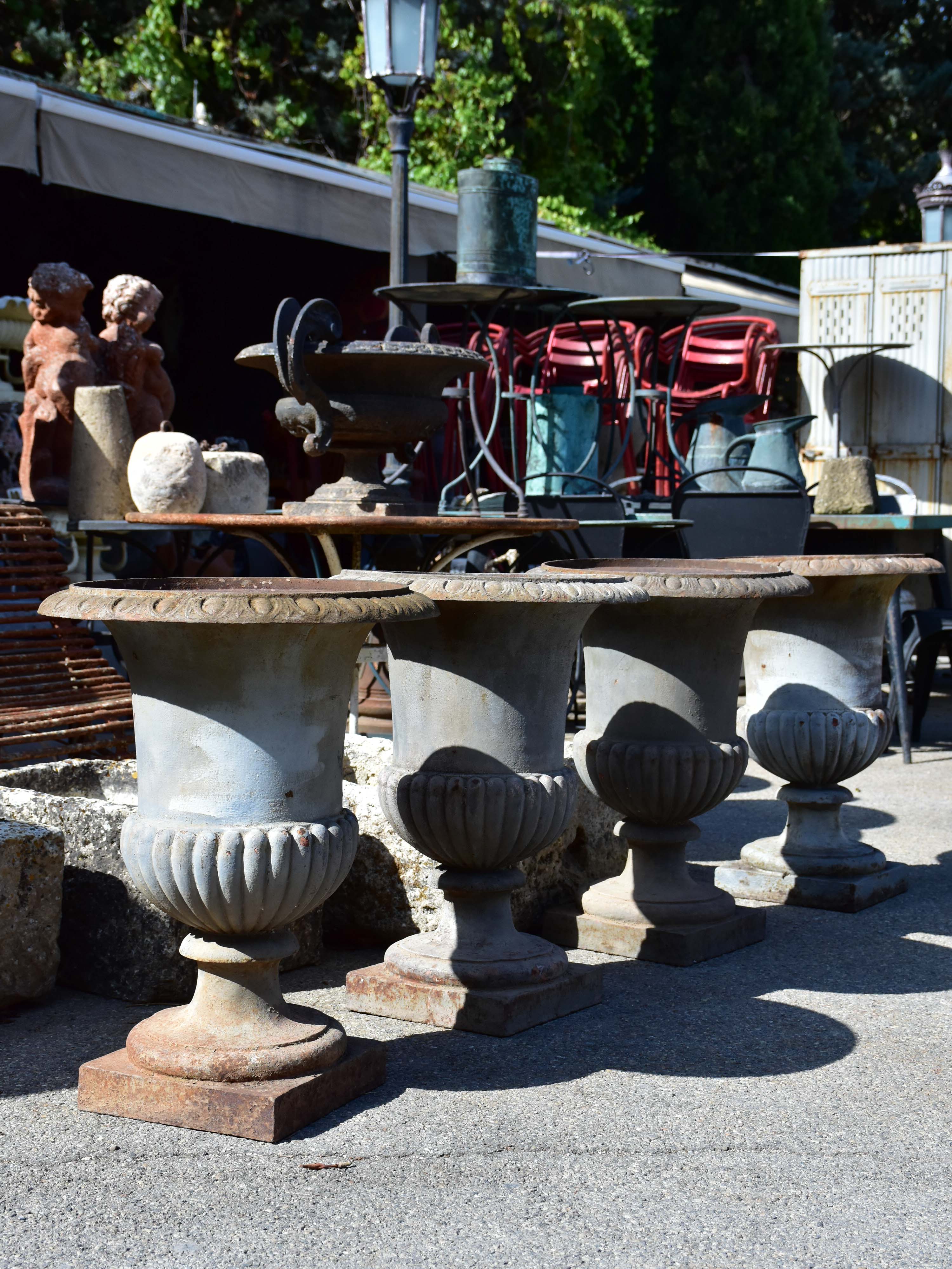 Collection of four cast iron medici urns from the 19th century