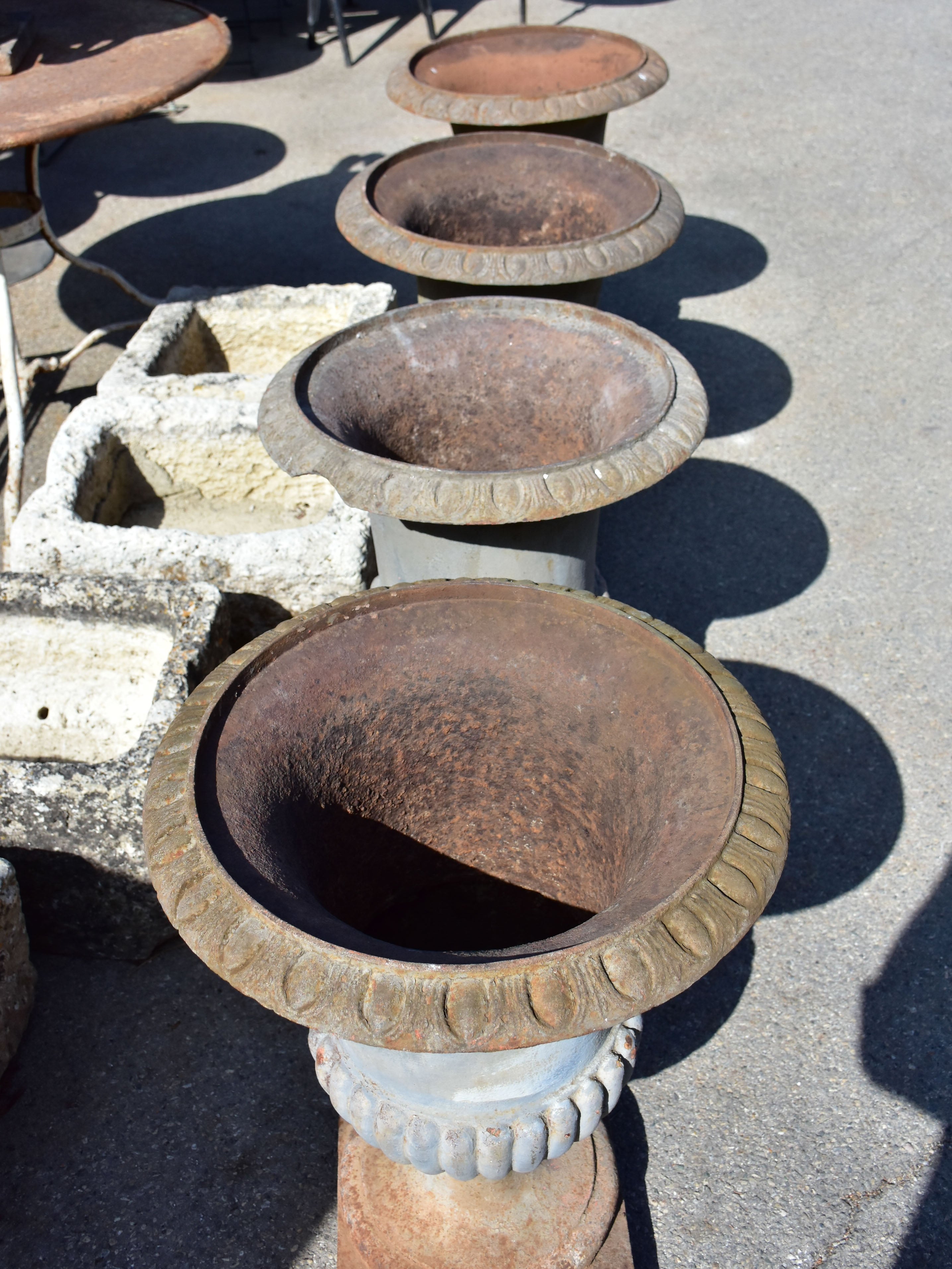 Collection of four cast iron medici urns from the 19th century