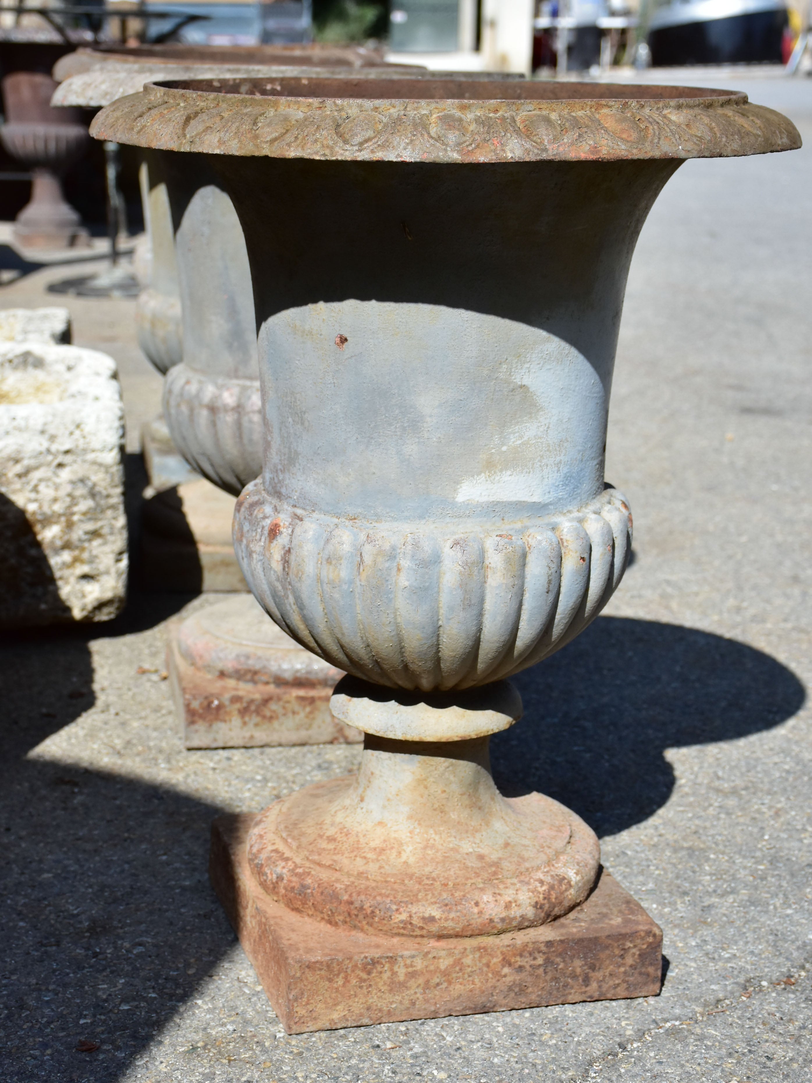 Collection of four cast iron medici urns from the 19th century