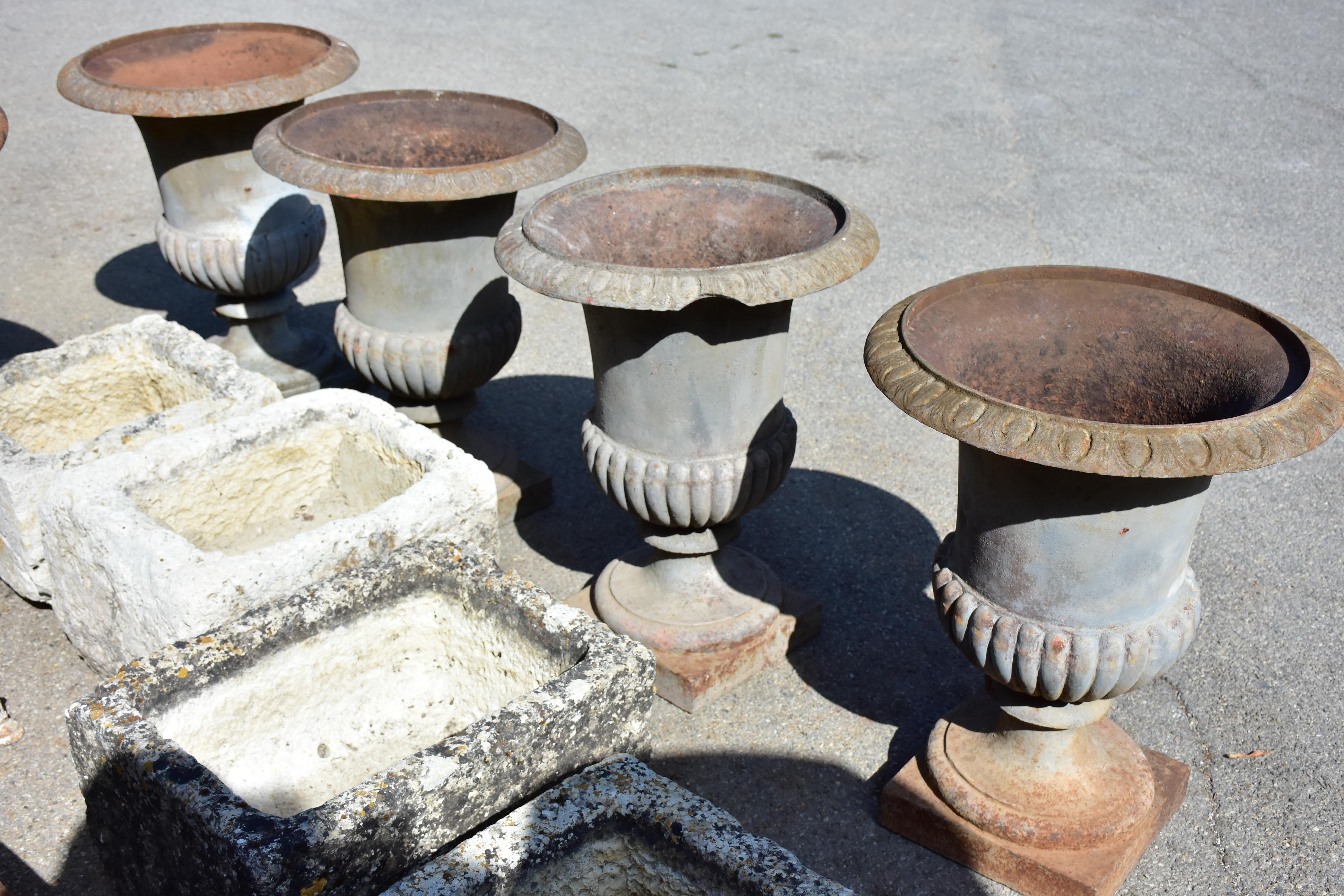Collection of four cast iron medici urns from the 19th century