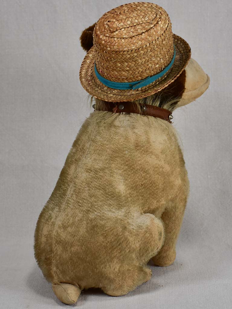 Early 20th-century toy dog with a hat