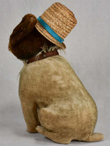 Early 20th-century toy dog with a hat