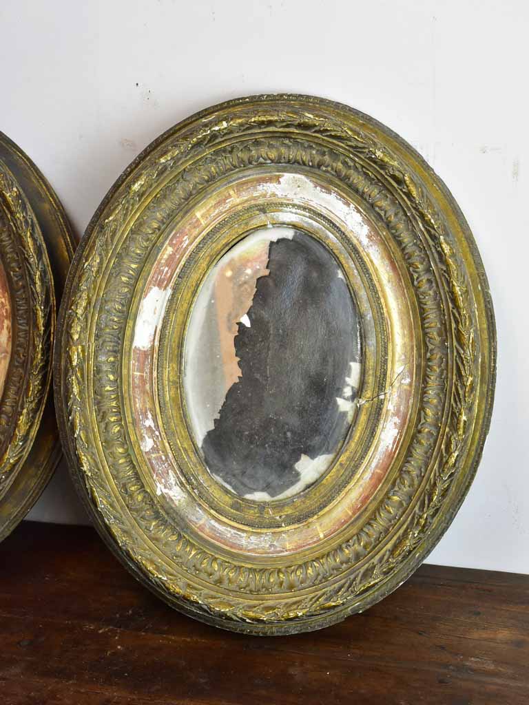 Pair of oval Louis XVI mirrors 19¼" x 15¾"