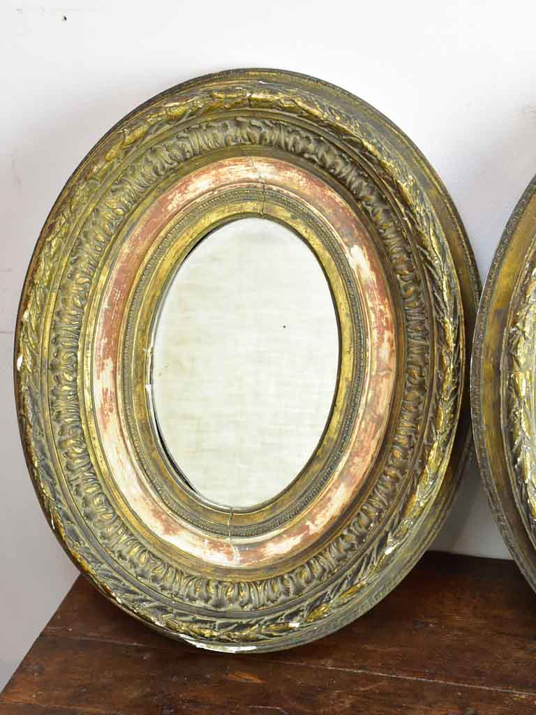 Pair of oval Louis XVI mirrors 19¼" x 15¾"