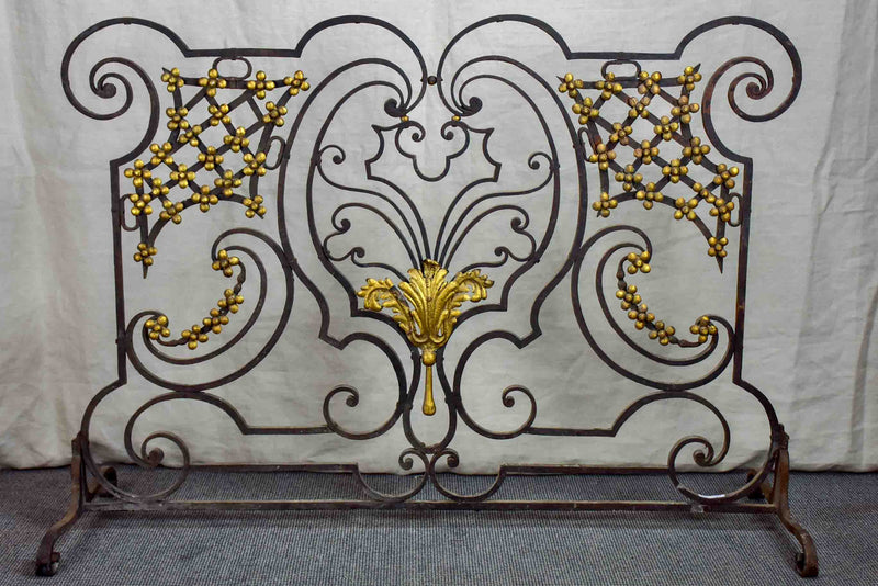 Wrought iron fire screen with flowers