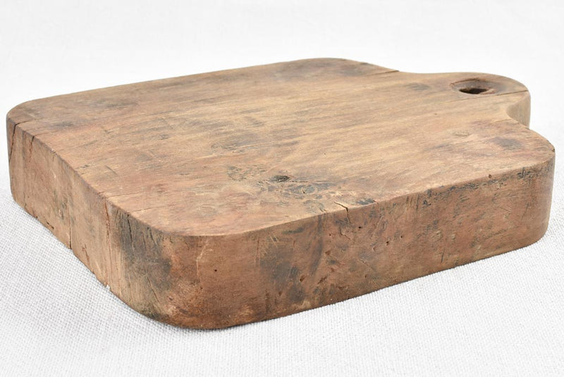 Small rustic walnut cutting board 8¾"