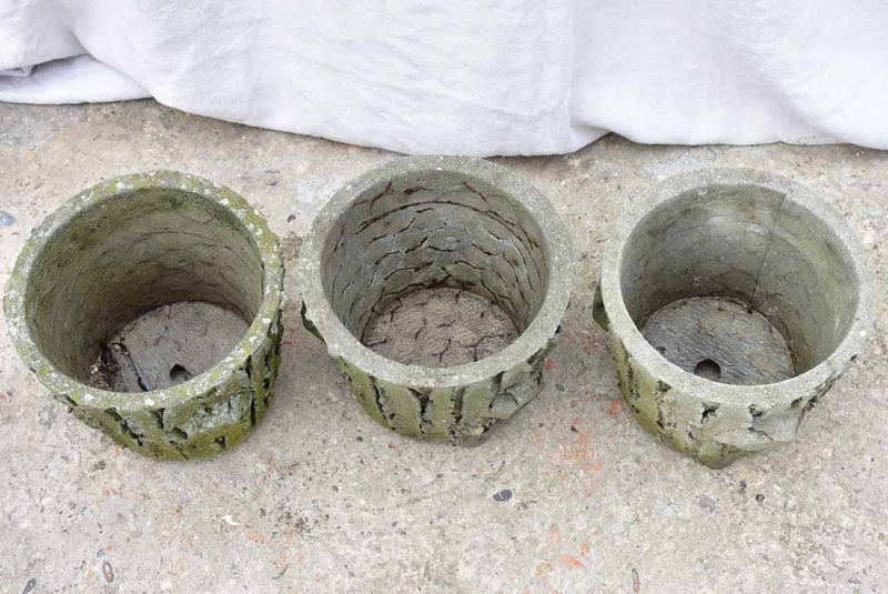 Three antique French faux bois flower pots with feet