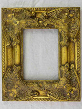 Timber and stucco frame with gold patina