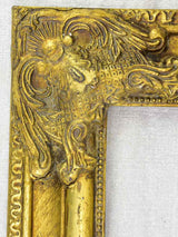 Timber and stucco frame with gold patina