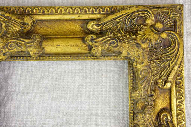 Timber and stucco frame with gold patina