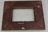 Timber and stucco frame with gold patina