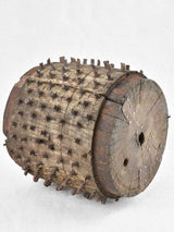 Antique salvaged wooden wheel with metal spikes 9"