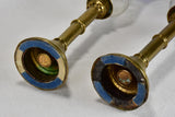 Pair of worn brass candlesticks