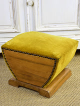 Antique footrest with mustard velvet upholstery