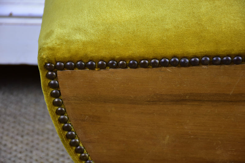 Antique footrest with mustard velvet upholstery
