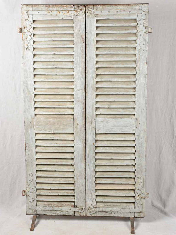 Pair of 19th century French oak shutters on stand 74¾" x 44"