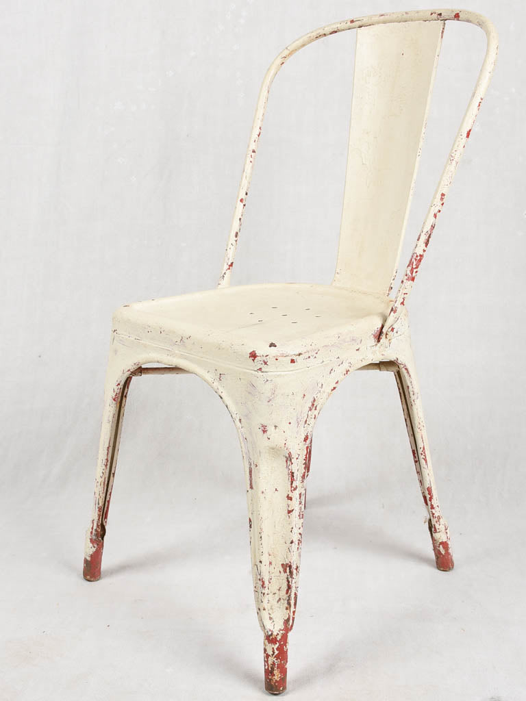 Four 1950s Tolix chairs w/ beige paint finish