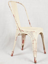 Four 1950s Tolix chairs w/ beige paint finish