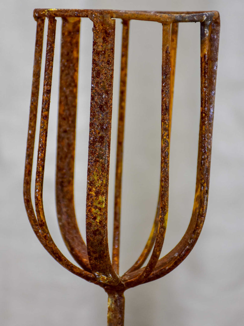 Pair of cup-shaped rustic candlesticks