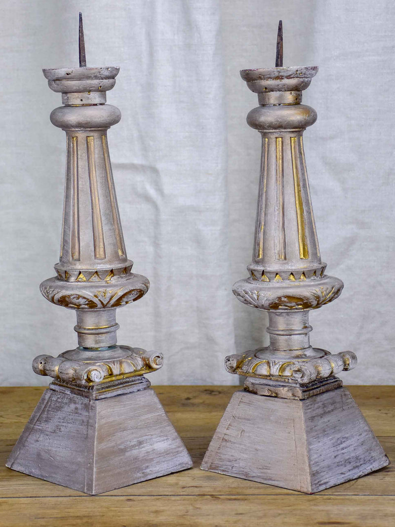 Pair of artisan-made candlesticks from salvaged materials